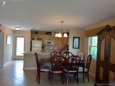 Living area looking back to dining area, kitchen a