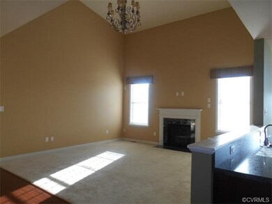 The family room has vaulted ceilings, a gas firepl