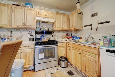 Kitchen featuring stainless steel range with gas s