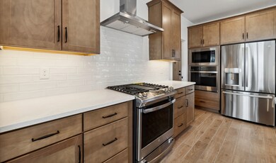 Kitchen with matte black hardware & wall oven