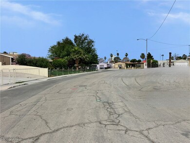 View of asphalt street with street lighting, sidew