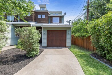 View of front of house with fence, concrete drive