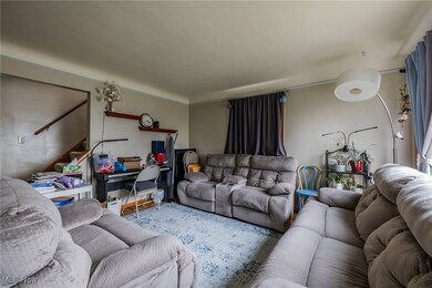 Living area featuring stairs and an office area