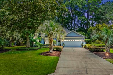 View of front of property featuring a garage and a