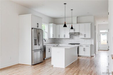 Kitchen with appliances with stainless steel finis