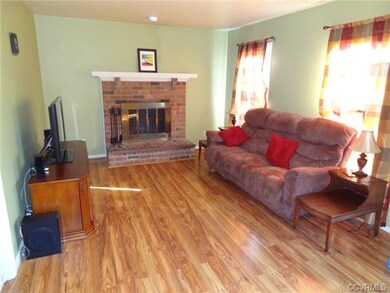 Family room with brick, wood burning fireplace and