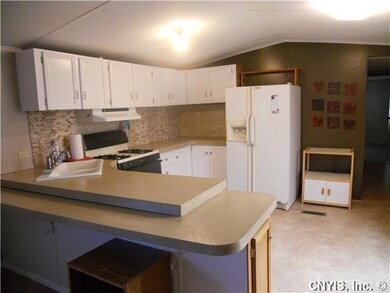 Kitchen from the living room looking into the kitc