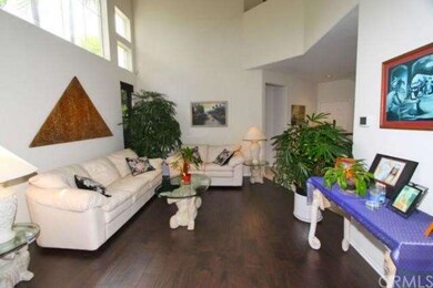 Formal Living Room with Vaulted Ceiling and Featur