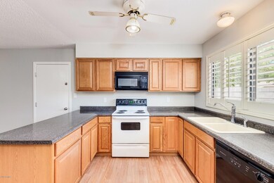 Bright open kitchen, plantation shutters