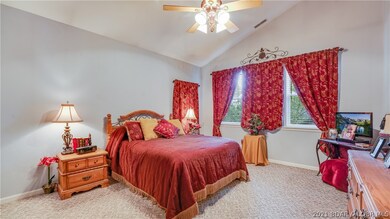 Master bedroom is large and the vaulted ceilings m