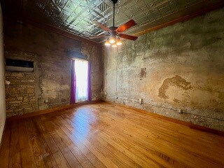 Spacious bedroom with original hardwood floors, ex
