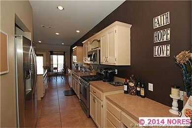 This kitchen boasts of storage including a pantry.