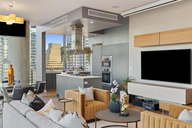 Living area featuring visible vents and light woo