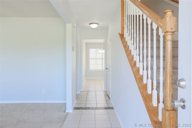 Entrance to home.  Living room to left; kitchen st