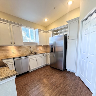 kitchen also has a wine cooler & full size washer/