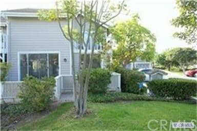 Rear view, note enclosed rear yard with patio