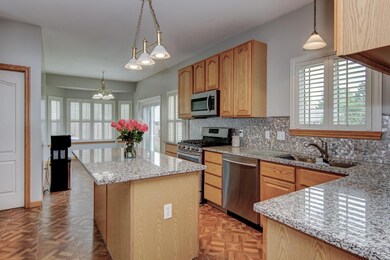 Kitchen has Granite counters and attractive alumin