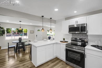 This open and airy kitchen flows seamlessly within