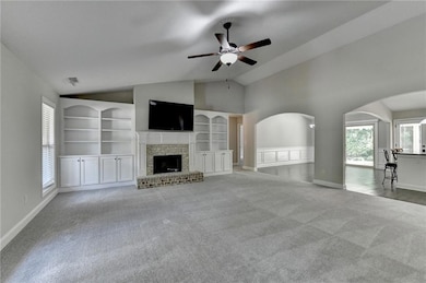 Unfurnished living room with carpet flooring, buil