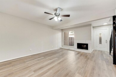 Unfurnished living room featuring a tile fireplace