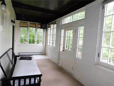 Enjoy all seasons from the enclosed porch.