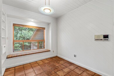 Empty room featuring tile patterned floors