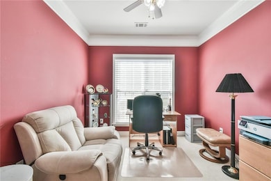 Office space featuring a ceiling fan, visible vent