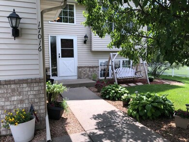 Welcome- nicely landscaped yard and front walkway.