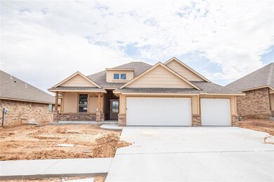 Craftsman inspired home featuring a porch and a ga