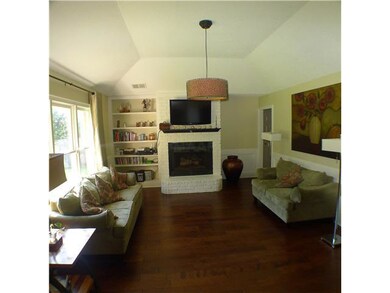 This large great room features a fireplace, built-