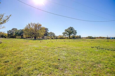 View of yard with a rural view