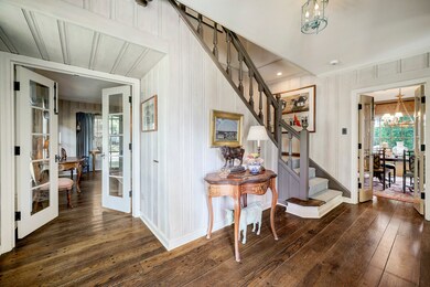 Entry provides access to formal living room, dining and separate hall to powder bath and breakfast room