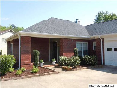COVERED PORCH ENTRY WITH VERY NICE LANDSCAPING!
