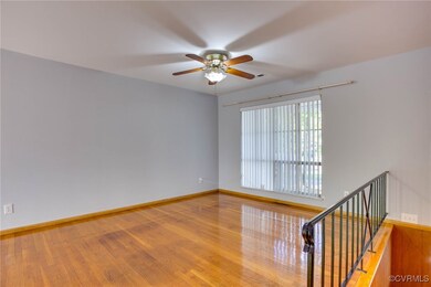 w/hardwood style flooring and ceiling fan