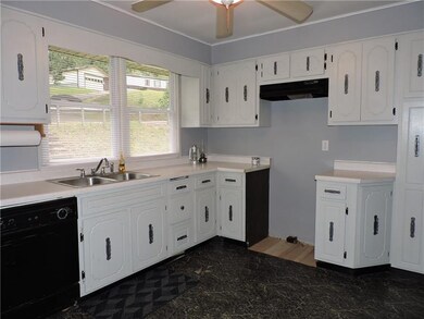 This Light and Bright Eat-In Kitchen Has all the C