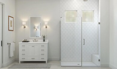 Primary bath with glass shower enclosure