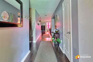 View from front door. Split floor plan: secondary bedrooms to the right and primary bedroom to the left