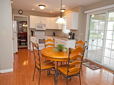 Charming breakfast area with sliding glass doors t