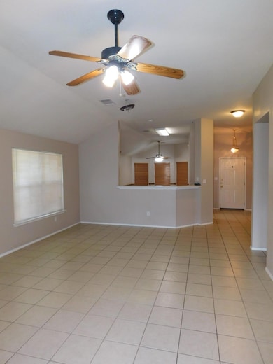 Unfurnished living room featuring ceiling fan, va