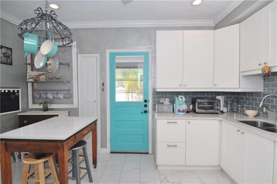 Kitchen view from dining room entry way