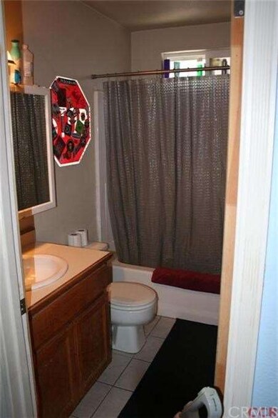 Updated bath with tiled floor.