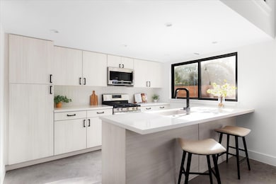 Kitchen featuring appliances with stainless steel
