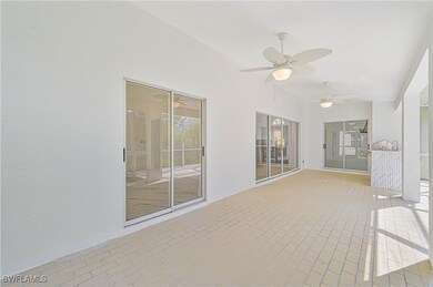 Unfurnished sunroom featuring ceiling fan