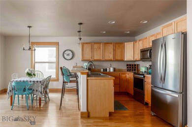 Wood cabinetry, wood flooring, stainless appliance