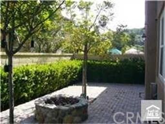 The patio is enclosed for privacy and is completed