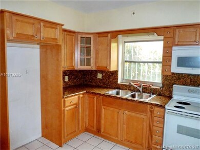 kitchen with window to side of house