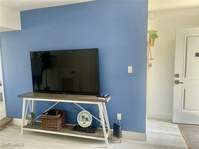 Room details featuring baseboards and wood finished floors