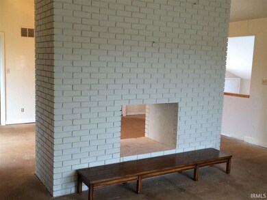 A photo of the  fireplace taken from the living ro