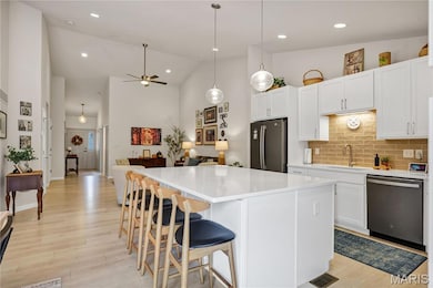 Fabulous Silestone Island with Breakfast Bar & an Abundance  of Beautiful Upgraded Lighting Throughout
