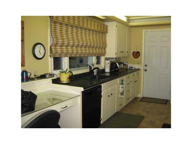 Kitchen. Built in desk to left of photo.